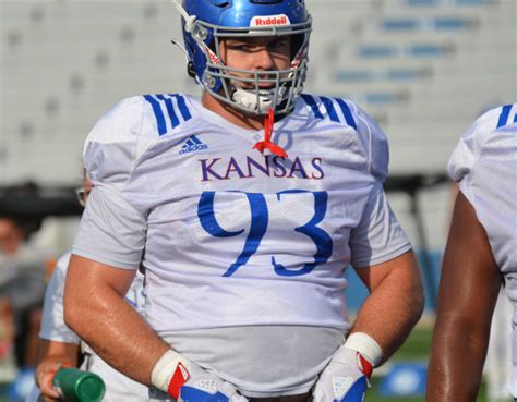 Sam burt ku football. Sep 3, 2020 · When Kansas football coach Les Miles speaks publicly about his team’s defensive linemen, he describes them as “big, strong, athletic men.” While that may be true, senior defensive lineman ... 
