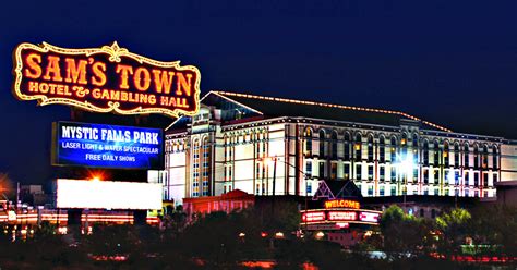 Sam town. Sam’s Town Hotel and Gambling Hall is owned by Boyd Gaming Corporation. Sam’s Town features 12 restaurants, an 18-screen movie theater, 56-lane bowling center, a 12,000 square foot entertainment center and 25,000-square-foot Mystic Falls Park with waterfalls, footpaths, mountain & nightly laser shows Mystic Falls Indoor Park. 