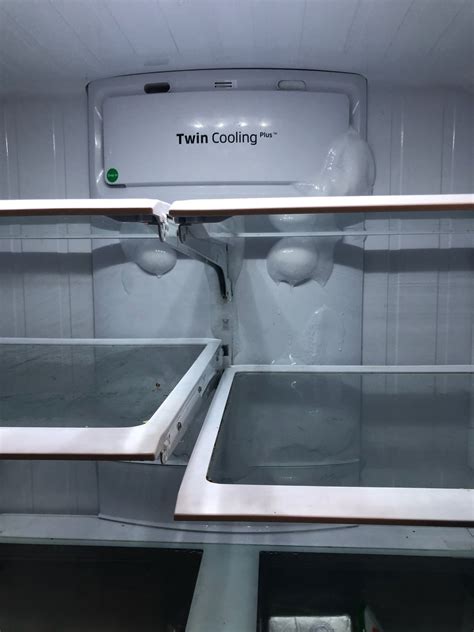 Samsung fridge frozen in back. These are the 10 most common Samsung Twin Cooling fridge freezer problems: Faulty evaporator/condenser fan. Fridge isn't cooling properly. Faulty door seal. Freezer won't defrost. Faulty ice maker. Problems with the compressor. Fridge is leaking water. Fridge is leaking refrigerant. 