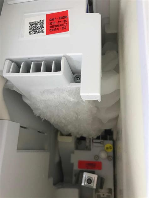 Samsung fridge ice maker not working. If a block of ice forms in the freezer compartment's ice bucket, clear the ice away and look for a white wire hanging down from the ice maker. If you see this wire, please call us at 1-800-SAMSUNG. If you don't see the wire, then it's possible the ice is from a spill in the ice bucket. Continue to use the refrigerator, and if another block of ... 