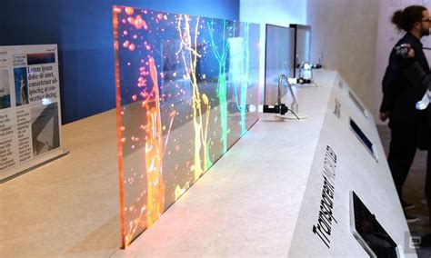 Samsung transparent tv. The LG Signature OLEF-T, the first ever 4k, wireles transparent TV was unveiled. The glass-like Television is built to stand in the middle of a room. The see-through television, when turned on, is ... 