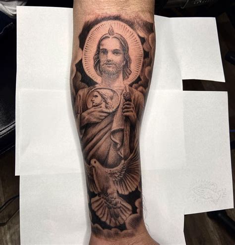 Credits: jhaiho.com. San Judas Tadeo tattoo designs often incorporate specific motifs that hold deep meaning and significance. For example, the image of a flame is commonly included in these designs to symbolize the eternal light of faith and hope that San Judas Tadeo represents.. 