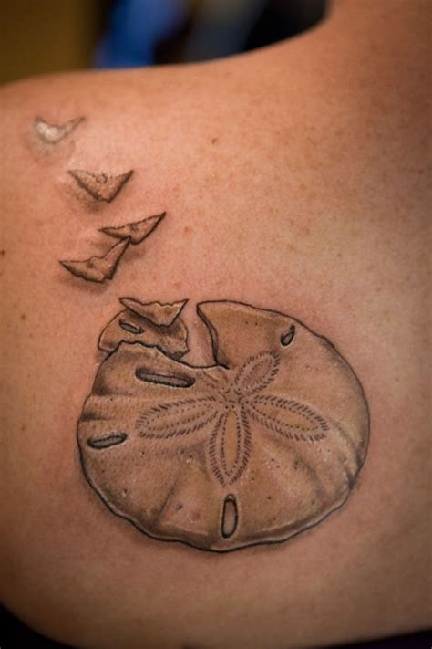 So, what does a sand dollar tattoo represent? For many, the sand dollar symbolizes new beginnings, hope, and rebirth. The flat, round shape of the sand dollar is often seen as a symbol of the sun, which is associated with new beginnings.