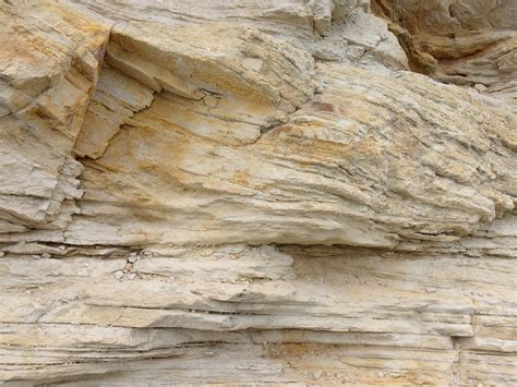 Sandstone striations. Prehistoric sand dunes, compressed into sandstone, are now revealed in sandstone layers subject to the carving erosive forces of wind .... 