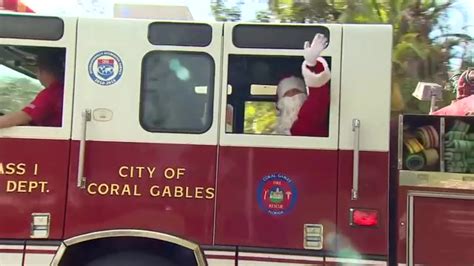 Santa trades sleigh for fire truck, joins Coral Gables firefighters in neighborhood ride