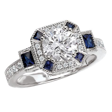 Sapphire and diamond engagement ring. This stunning engagement ring features an oval blue sapphire prong set at the center of a three-stone setting, with channel set diamond accents on the platinum band. It was created for a client as a custom piece, and we can work with you to adjust it until it’s exactly what you’ve been looking for. Design Your Own Engagement Ring. Three ... 