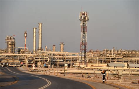 An employee looks on at Saudi Aramco oil facility in Abqaiq, Saudi Arabia October 12, 2019. Saudi Arabian oil giant Aramco reported blowout full-year earnings on Sunday, posting a more than ...
