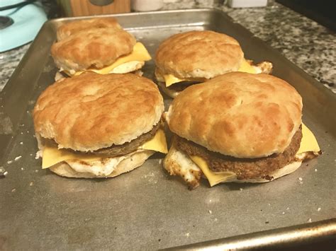 Sausage egg and cheese biscuit. Each fully cooked breakfast sandwich features a fluffy egg layer and seasoned sausage patty, topped with American cheese and enveloped in a tender and flaky ... 
