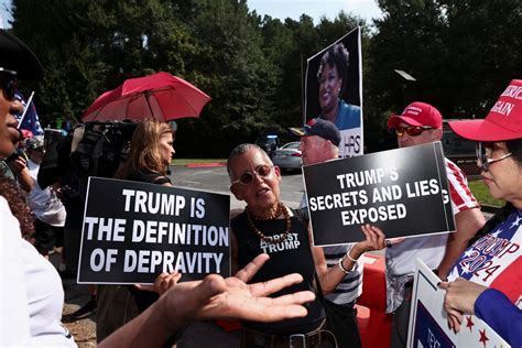 Scores of Trump supporters show support outside Georgia jail ahead of his expected surrender