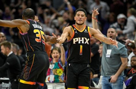 Scoring explosion from Devin Booker, Kevin Durant lift Suns to 121-114 Game 3 win, Nuggets’ series lead halved