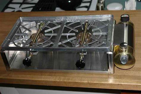 Sea cook stove. ; Base is stainless steel; Grate is porcelain coated cast iron; ...