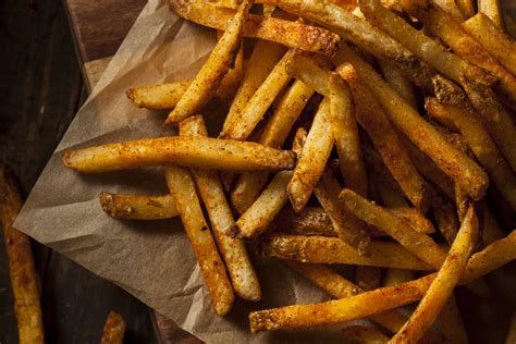 Season fries. Frozen french fries are easy to season because they have a layer of moisture on them when you remove them from the freezer. I like to use 2 teaspoons of the seasoning per 8 ounces of fries. How do you … 