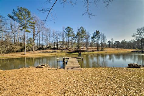 Secluded Country Home on Acreage with Pond & Sprawling Lawn