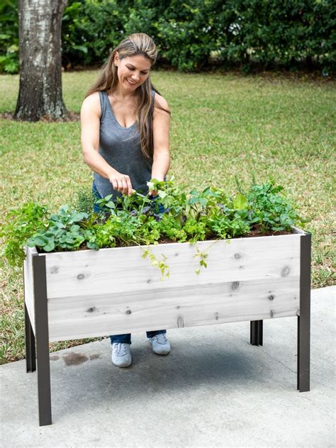 Product Details. Cedar, powder-coated aluminum, food safe poly whey. 39-1/2" L x 16-1/2" W x 34-1/2" H overall. 10-1/2" deep planting area. Holds 100 quarts of potting mix. Please note that planter boxes cannot hold regular garden soil, topsoil, sand, clay or rocks. 4-gallon water reservoir.. 