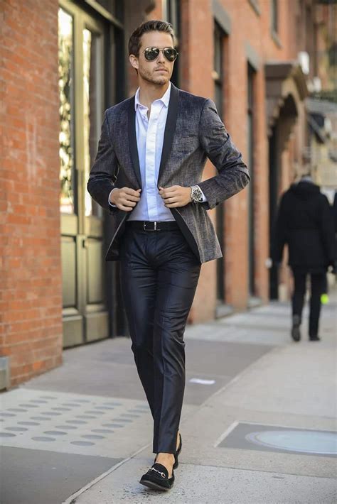 Semi-formal men. Ties and cufflinks are the most preferred ones. Other options include a wristwatch and if it’s a daytime outfit, you could go for classy sunglasses like the brown Ray Bans or blue aviators. The key for semi-formal dressing is to keep your accessories subtle. Here are 30 Best Charcoal Grey Suits with Black Shoes For Men. 