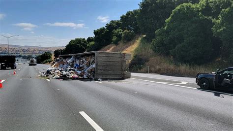 Semi-truck full of garbage overturns on I-680 in Dublin, delays expected 