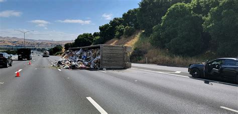 Semi-truck full of garbage overturns on I-680 in Sunol, delays expected 