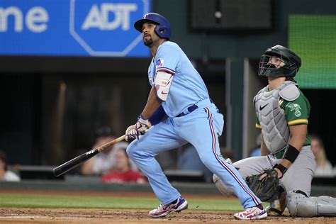 Semien has another 2-HR, 4-hit game as Rangers beat A’s 9-4 for 1st consecutive wins this month