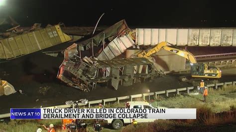 Semitruck driver killed when train derails on Colorado bridge, spilling coal cars onto major highway