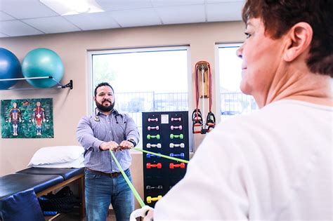 Senior resident and therapist in physical therapy session Las Cruces