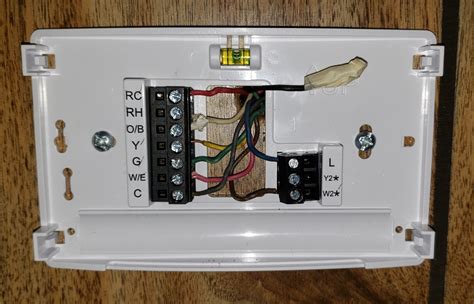 Sensi and Sensi Lite smart thermostat. One by one, insert each wire into the corresponding terminal by sliding the exposed wire into the opening on the side of the terminal block. As you connect each wire to the corresponding terminal, be sure to use a small screwdriver to tighten each terminal, securing the wire in place.. 