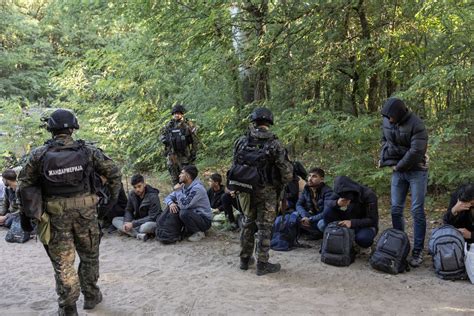 Serbian police arrest 7 people smugglers and find over 700 migrants in raids after a deadly shooting