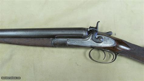 There are two models of Remington double barrel shotguns that fall into the serial number range you give, The Model 1889 and the Model 1900. The Model 1899 is an outside hammer gun while the Model 1900 is a hammerless so your gun is a Model 1899 and was made in 1905. The serial number range for 1905 is 214,400 to 221,600, a total of 7,200 guns ...