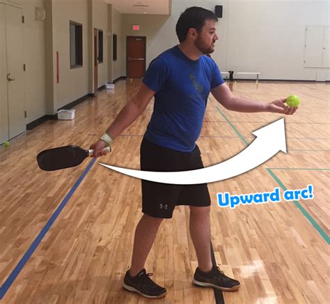 Serving in pickleball. Players must also serve the ball with an underhand motion with the paddle, and the paddle must remain below the waist for the whole serve. Pickleball serving line rules also require that players keep both of their feet behind the court’s line when serving. The ball cannot bounce before touching the paddle. 