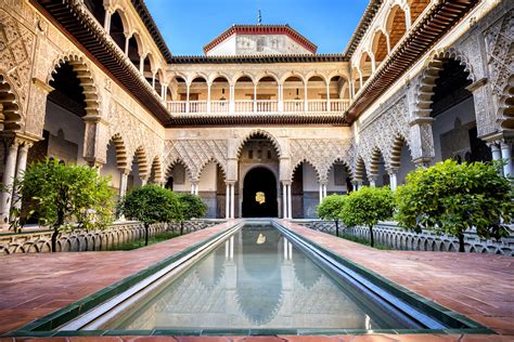 The Real Alcázar in Seville is a group of palaces surrounded by a wall. Peter the Cruel rebuilt the old Almohad building to establish a royal residence in the 14th century. It has contributions from all periods, although Mudejar and Renaissance styles are predominant..