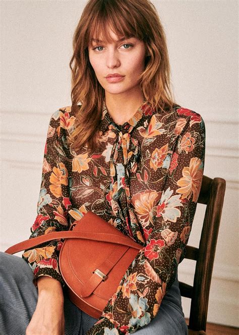 Sezane clothes. DescriptionDetails & CompositionOur ateliers. Long-sleeved midi dress. Shirt collar and button front. Removable belt to tie at waist. Flowing A-line shape. Patch pockets on chest. Unlined. Length from shoulder 120 cm / 47.2 in (for a 36) FSC certified. 