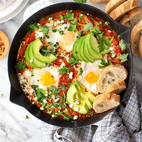 Shakshuka near me. Heat the olive oil in a large skillet or Dutch oven over medium-high heat. Add the diced onion and sauté until translucent, about 5 minutes. Add the garlic and sauté until fragrant, about a minute more. Add the diced bell pepper and cook until softened, about 7-10 minutes. 