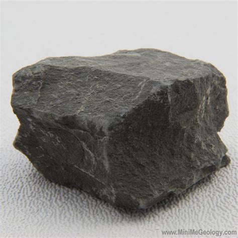 Shale is a sedimentary rock while slate is a metamorphic rock formed from shale. Slate is much more durable than shale due to the metamorphic process it undergoes. Slate and shale are similar in appearance. Visually, it can be hard to tell .... 