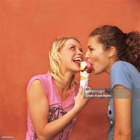 Sharing an ice cream cone Stock Photos and Images