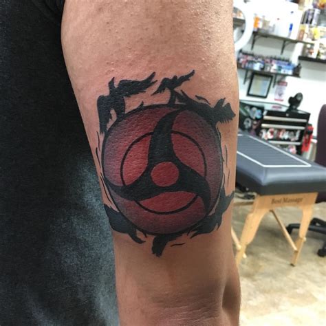 Itachi Uchiha tattoo ideas & designs. The Sasuke Uchiha crest is a well-known choice for Itachi tattoo designs. This can be done in various forms, including a basic black and white version or something more complex with colors. Getting a tattoo of Itachi’s Susanoo is another popular option.