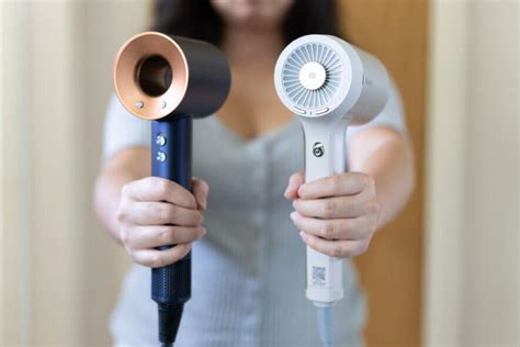 Shark vs dyson hair dryer. Dyson Supersonic™ hair dryer Nickel/Copper. 4.7 stars out of 5 from 23818 Reviews. 23818 Reviews. Fast drying, no heat damage. Includes five attachments to dry straight, wavy, curl, and coily hair. Hides flyaways in a single pass. For a smooth, shiny finish¹. Color: Nickel / Copper. 