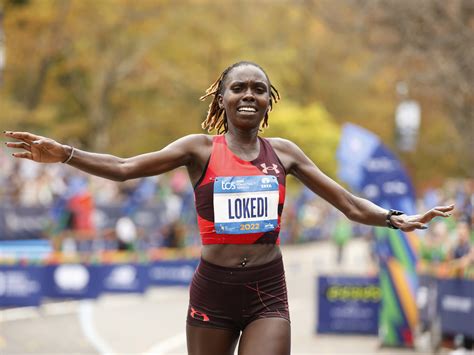 Sharon Lokedi, of Kenya, crosses the finish line first 