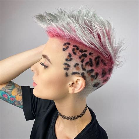 Shaved sides hairstyles. Ask for a pink bixie and bangs. This is a great cut for those with thick hair. Ask for an undercut with your bixie to eliminate bulk in the sides and nape area. Your stylist can get creative, leaving tendrils of hair in different lengths. It will create an interesting look for the edgy gal. Instagram @alanfontenele_. 