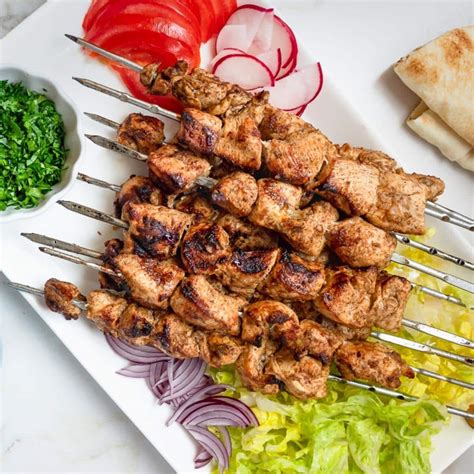 Shawarma kebab. Shawarma (/ ʃ ə ˈ w ɑːr m ə /; Arabic: شاورما) is a Middle Eastern dish that originated in the Levant region of the Arab world during the Ottoman Empire, consisting of meat that is cut into thin slices, stacked in an inverted cone, and roasted on a slow-turning vertical spit.Traditionally made with lamb or mutton, it may also be made with chicken, turkey, … 