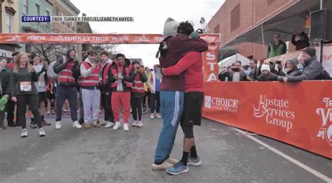 She said 'yes'! Meet the couple behind the Troy Turkey Trot proposal