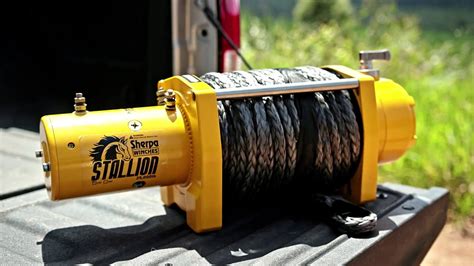 In this video the harbor freight badlands 12000 winch gets put to the test pulling out a very stuck ~6800lb tractor.. 