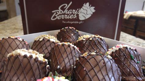 Sherries berries. Large artisan strawberries hand-dipped in rich Belgian dark chocolate and topped with dark chocolate curls, freeze-dried strawberry pieces and coconut flakes. Fruit is picked at the peak of freshness and packaged in a luxury gift box See Details. 24-count box serves approximately 4-6 people; serving size 140 grams. 