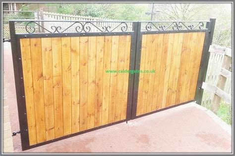 Sherwood metal driveway gate with wood infill by Calder Gates