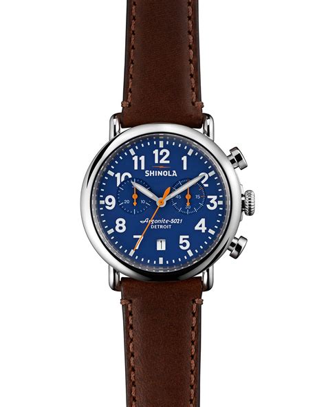 Shinola. This high-accuracy quartz movement, which is hand-assembled in Detroit with Swiss and other imported parts, drives the hours, minutes, seconds and calendar aperture function with precision. Crafted from TR90 resin, a material known for its strength, this 43mm case is anchored by a stainless steel core. The midnight blue case has a glossy finish ... 