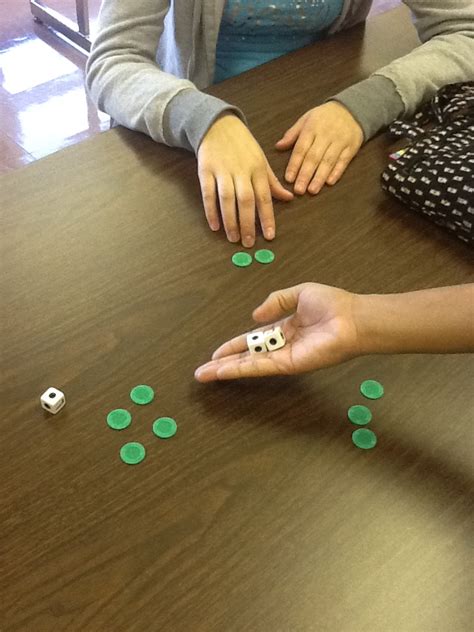 Shootin’ DICE to learn location Creative Language Class