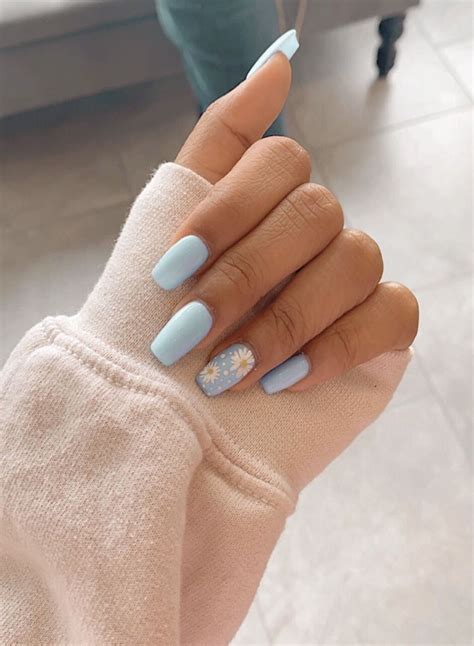 Short acrylics inspo. Choose a base color that complements your skin tone, such as red, deep burgundy, or icy blue, and then add a metallic design on one or two accent nails. This will create a chic and eye-catching look without overpowering your shorter nails. Another trendy option for short winter nails is geometric designs. 
