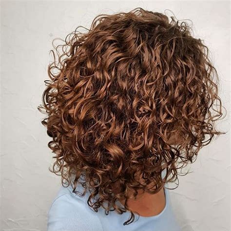 1: Short Hairstyle for Wavy Hair. This haircut is perfect for adding some volume and texture to your wavy hair. The layers create movement and dimension, while the blonde color brightens up your complexion. You can style this haircut with a curling iron or a diffuser to enhance your natural waves. Source.. 