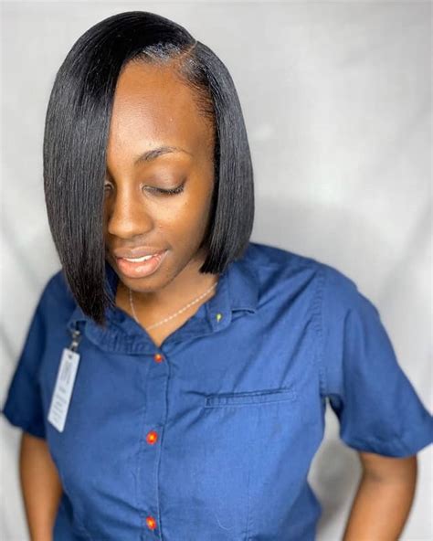 A blonde ombre is a great way to lighten your black girl hairstyle. Opt for it on a layered, asymmetrical, neck-length bob cut like this one by master cosmetologist Lady Butterfly of Georgia. This is a razor-cut bob using a straight razor and guard. It can be achieved with a bond-in (glue) or sew-in (needle and thread) service..