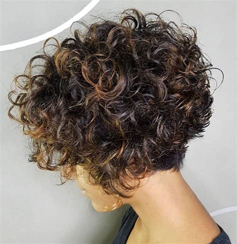 1. Curly Mid Length Bob with Bangs. This curly bob with bangs look is very relaxed and casual, where the natural short hair is in loose curls. The length is just above the shoulders and the bangs are falling over the forehead. It is appropriate for those with thick hair. 2. Curly Bob with Side Bangs..
