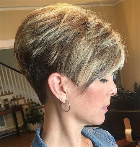 Short stacked pixie haircut. #1. Silver Stacked Short Haircut - Shaved Hairstyle for Women Credit Silver is a super trendy hair colour which is growing and growing in popularity. It becomes especially cool when paired with a stacked hairstyle! Steal this style by choosing a classic stacked pixie cut with a lovely, long and sweeping fringe section. 
