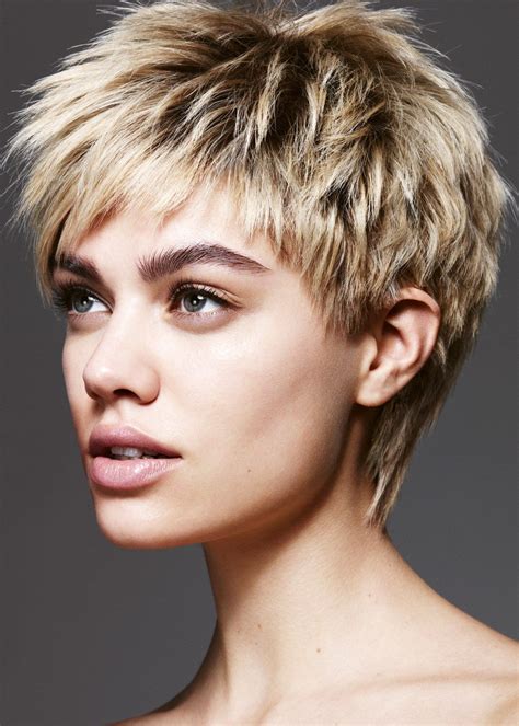 10. Very Short Textured Ash Blonde Cut. A fabulous example of how short you can go with a pixie-cut and still stay youthful and feminine. Boyish, (but not masculine by any means), a very short textured back and neat sides give way to a flounce of tamed blonde locks at the top.. 